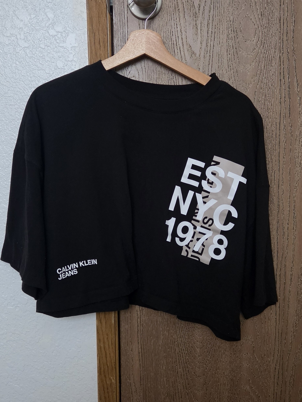 Calvin Klein Jeans Cropped Black Graphic Tee with White & Beige Print
